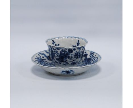 Early 18th century Chinese export blue and white saucer, (Kangxi 1662 - 1723) with underglazed blue carp within foliage and T