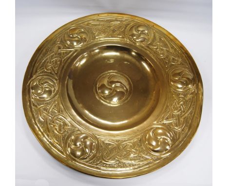 Arts &amp; Crafts Celtic Revival brass charger, c. late 19th/early 20th century, decorated with repeated knots interspersed b