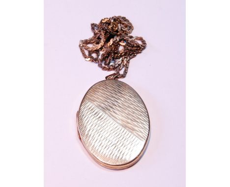 9ct gold oval locket, part engine turned, with necklet, 20g gross. 