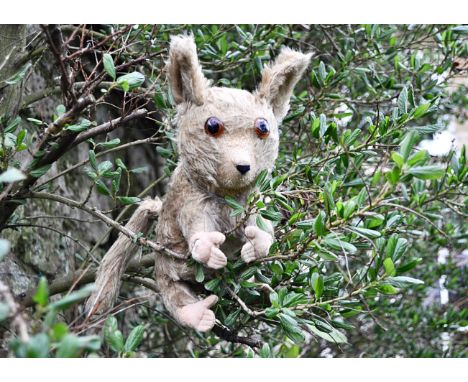 Baby a British Manufacturing Co Ltd Omega Bush Baby 1930s, with light brown mohair, large clear and black glass eyes with bro