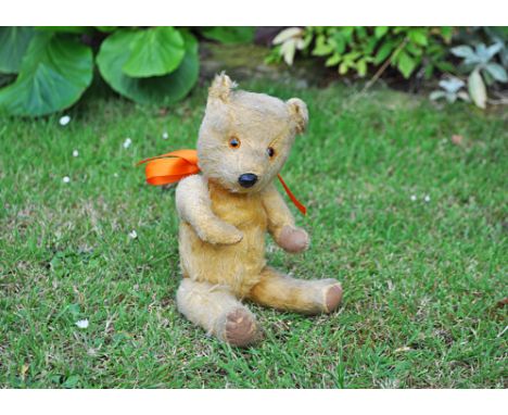 Reginald a Chiltern Hugmee teddy bear late 1950s, with golden mohair, orange and black plastic eyes, black plastic nose, swiv