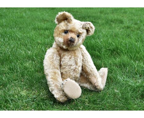 Jake an early Farnell teddy bear 1920s, with light golden mohair, clear and black glass eyes with remains of brown painted ba