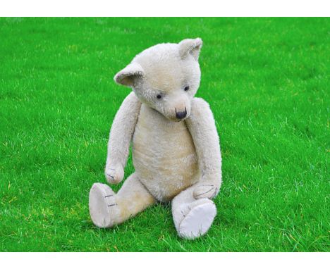 Errol a 1920s Chiltern teddy bear,  with short blonde mohair, clear and black glass eyes with remains of brown painted backs,