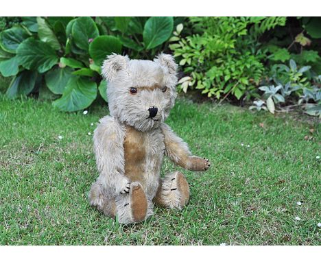 Egbert a Chiltern Hugmee teddy bear late 1950s, with blonde mohair, orange and black plastic eyes, black stitched nose and mo