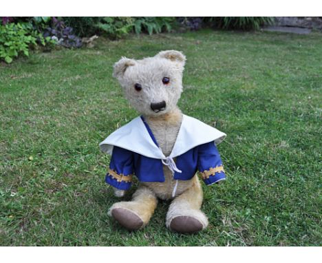 Old Pierre  a 1930s teddy bear, with light golden mohair, replaced orange and black glass eyes, pronounced muzzle, black stit