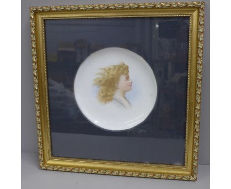 A gilt framed porcelain plate with portrait 