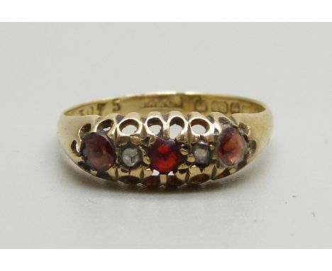 An 18ct gold, garnet and diamond ring, Birmingham mark, 2.2g, L/M, a/f, stones worn 