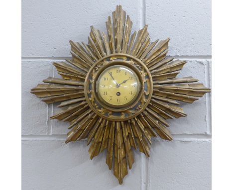 A wooden starburst clock 