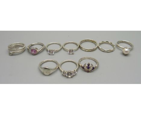 Ten rings; one marked 925, the rest test as silver, 31g, (various sizes J to R) 