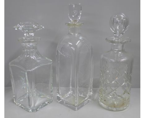 Three decanters; Baccarat, Orrefors and one other 