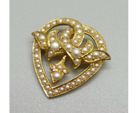 A 15ct gold and pearl pendant, 4.5g, 23mm wide, lacking brooch pin 