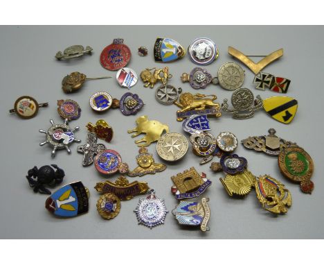 A collection of enamel badges and pins 