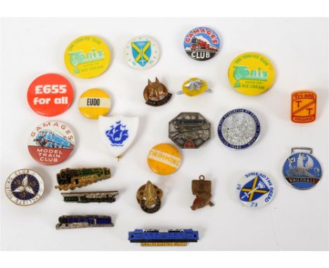 ASSORTED BADGES  comprising a plastic Tri-ang TT Railways lapel badge; Gamages Club pin badge; Gamages Model Train Club pin b