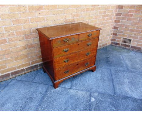 A GEORGE III MAHOGANY CHEST OF TWO SHORT AND THREE LONG DRAWERS  on bracket feet, 80cm wide 49cm deep 76cm high 