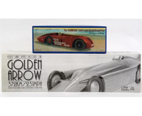 TWO TINPLATE WORLD LAND SPEED RECORD RACING CARS  comprising a Schylling Golden Arrow, gold, with a clockwork motor, boxed; a