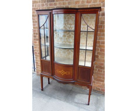 AN EDWARDIAN DISPLAY CABINET  with bow front glass door and marquetry inlaid decoration, 105cm wide 41cm deep 175cm high