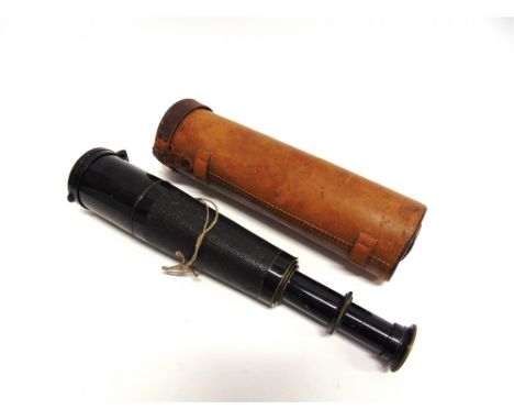 A SERVICE ISSUE FOUR DRAW TELESCOPE  unsigned, with an engraved arrow-head mark, a sliding spray-guard and a hinged lens cap,