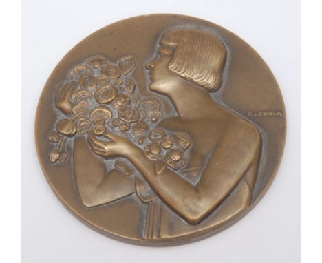 An Aesthetic Movement French bronze medal, Obv. engraved M. Janvier, Rev. female with bouquet of roses facing to dexter, sign