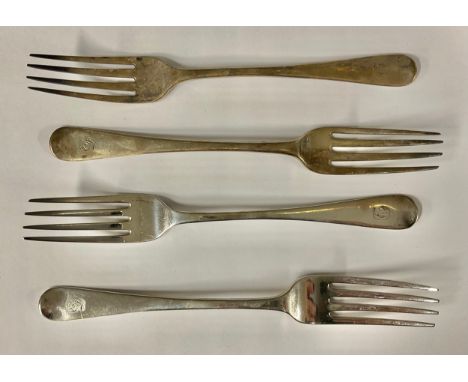 A George III silver table fork, London 1810; a George IV silver table fork, London 1825; other Georgian table forks; 235.5g (