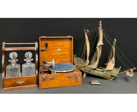 A late Victorian silver cigarette case, 8cm high, Birmingham 1894; a two bottle tantalus frame, brass carrying handle, pair o