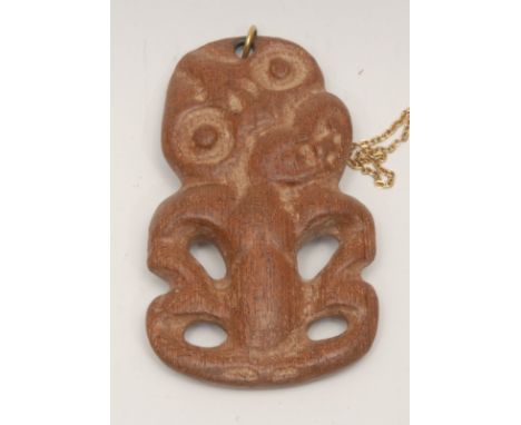 Tribal Art - a Maori hardwood tiki pendant, typically carved and pierced, 9cm long, New Zealand, first-half 20th century