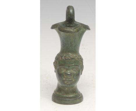 A Grand Tour verdigris patinated cabinet model, of an Ancient Greek oinochoe, cast after the antique with the head of a Nubia