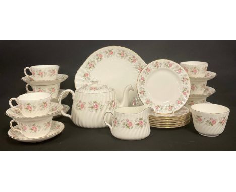 A Minton Spring Bouquet tea service for eight, comprising teapot, cups, saucers, cake plates, sugar bowl, milk jug, etc