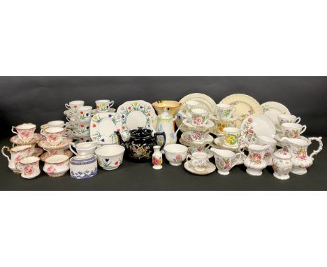 An Art Deco Wetley China Tulip pattern part tea service, comprising cake plates, side plates, cream jug, sugar bowl, cups and