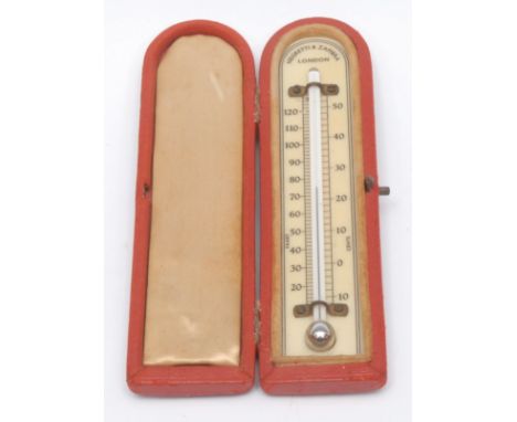 An Edwardian mercury travelling thermometer, Negretti &amp; Zambra London, ivorine dial, leather diptych hard case, 14cm x 4c