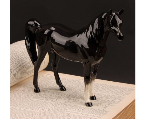 A Beswick model of a horse, Arab Xayal, in charcoal/black, model 1265, 16cm high, printed mark in gold