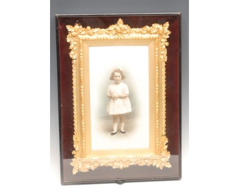Photography - an early 20th century presentation studio portrait photograph, of a young girl, colour tinted, the ebonised cas