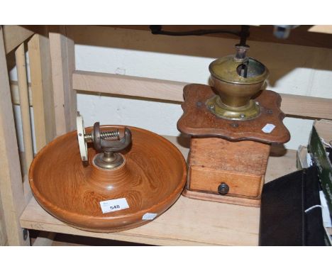 Vintage coffee grinder and a vintage nut cracker on turned wooden base