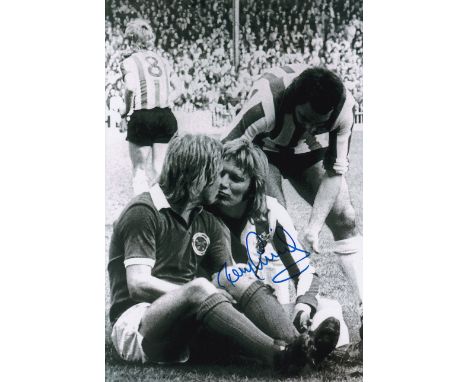 Autographed TONY CURRIE 12 x 8 photo : B/W, depicting the moment when Sheffield United's TONY CURRIE and Leicester City's Ala