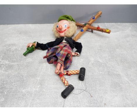 A Pelham puppet of a Scottish man in national dress.