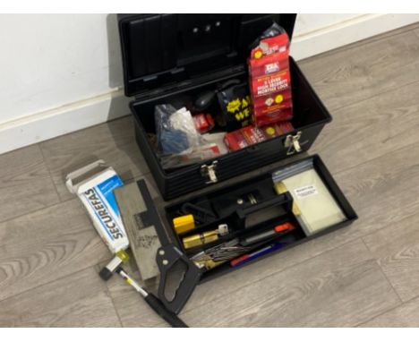 Plastic toolbox containing mixed locksmith tools