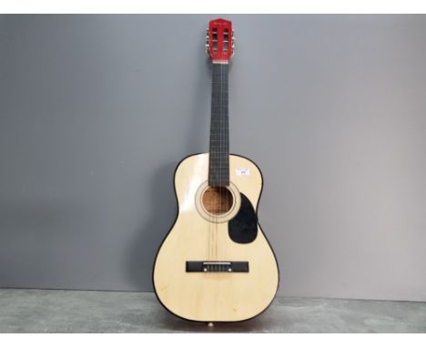 A Ready Ace acoustic guitar.