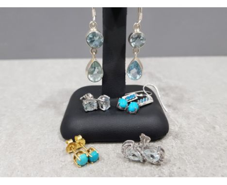 5× sterling silver earrings (incl. 1 gold plated) with light blue stones, 14.9g gros.