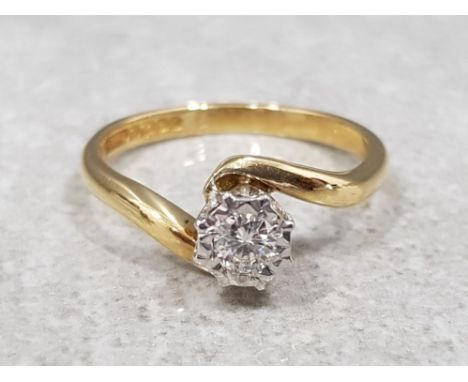 Ladies 18ct yellow gold solitaire diamond ring, comprising of a round brillaint cut diamond set in a white claw setting apx. 