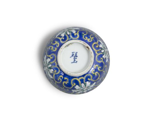 A BLUE GROUND ‘LOTUS’ PORCELAIN BOWL INSCRIBED WITH THE MARK NGOẠN NGỌC 玩玉 VIETNAM, NGUYEN DYNASTY, 19TH CENTURY Resting on a