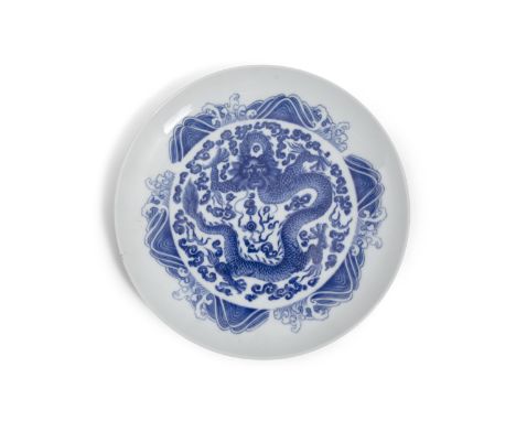 A BLUE AND WHITE PORCELAIN ‘DRAGON’ PLATE APOCRYPHAL MARK OF EMPEROR YONGZHENG CHINA, 20TH CENTURY Of circular shape, it is p