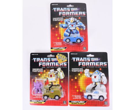 Three Original Carded Hasbro G1 Transformers, Throttlebot- Rollbar, Searchlight and Freeway  1986 issues transforms from moto