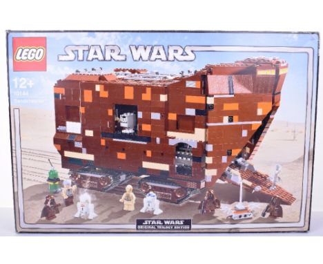 Lego Star Wars Sandcrawler, Set 10144, 2005 issue, with instruction manual,  bags still factory sealed .Outer box lid is in g