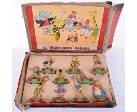 The Rainbow comic, The ‘Bruin Boys’ Parade pull along toy by Chad Valley, ten shaped paper printed on wood comic characters, 