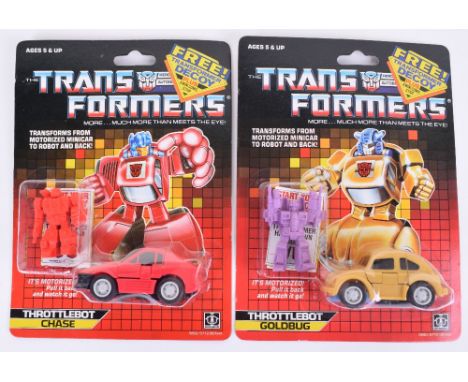 Two Original Carded Hasbro G1 Transformers, Throttlebot Chase and Goldbug  1986 issues transforms from motorized minicar to r