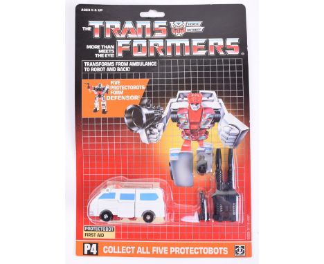 Original Carded Hasbro G1 Transformers, P4 Protectobot ‘First Aid’ transforms from ambulance to robot and back, 1986 issue, m