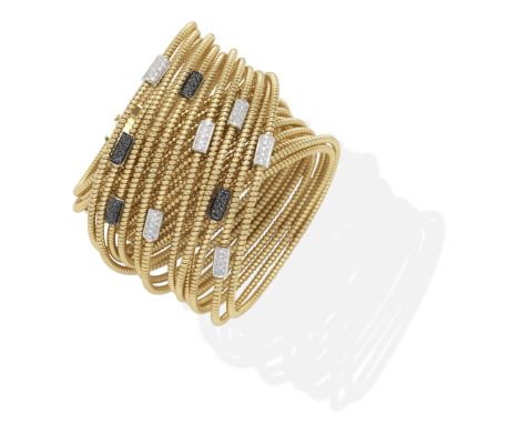 DIAMOND BANGLE/CHOKEROf gaspipe-linking, accented by brilliant-cut diamond and treated black diamond rondels, diamonds approx