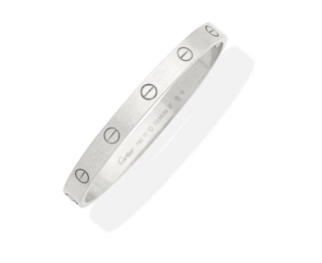 CARTIER: 'LOVE' BANGLEWith nailhead motifs, mounted in 18 carat white gold,  signed Cartier, numbered TZ8636, Swiss assay mar