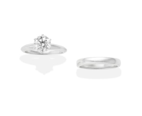 TIFFANY: DIAMOND SINGLE-STONE RING AND WEDDING BANDSet with a brilliant-cut diamond, weighing 1.46 carats, with a matching ba