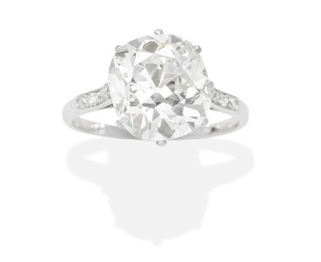 DIAMOND SINGLE-STONE RINGThe cushion-shaped diamond weighing 4.34 carats, between diamond-set shoulders, French assay mark, r