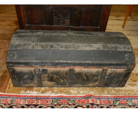 A late 19th century hide and iron bound trunk. W.103cm 